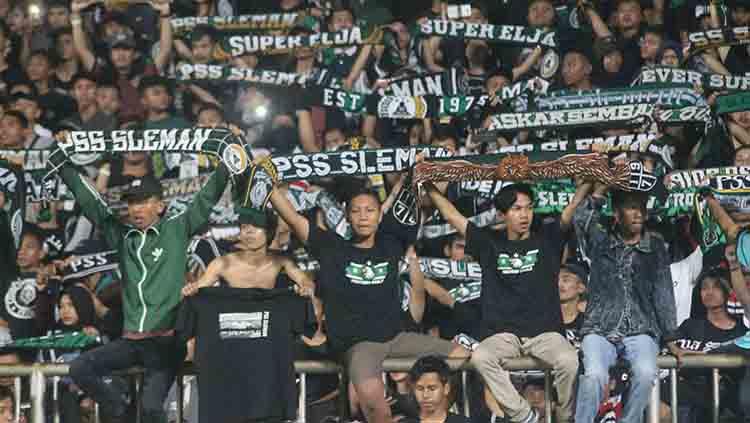 Pendukung setia PSS Sleman, Brigata Curva Sud. Copyright: Ronald Seger/INDOSPORT