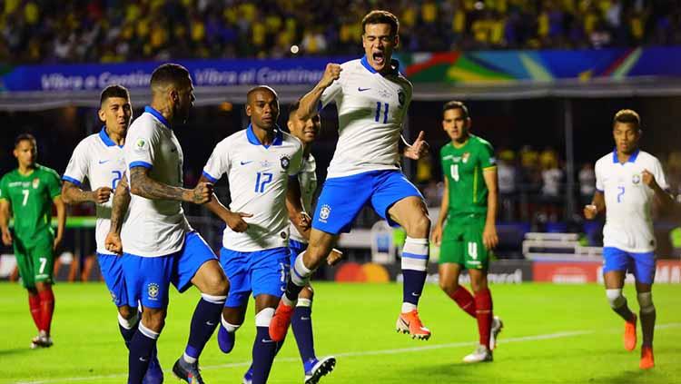 Selebrasi pemain Brasil, Philippe Coutinho usai menjebol gawang Bolivia pada pertandingan Copa America Brazil 2019, Sabtu (15/06/2019). Foto: Chris Brunskill/Fantasista/Getty Images Copyright: Chris Brunskill/Fantasista/Getty Images