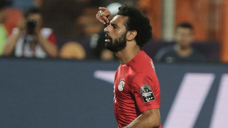 Mohamed Salah melakukan selebrasi usai cetak gol menit ke-43 dalam penyisihan grup Piala Afrika 2019 di Stadion Internasional Kairo. Copyright: Omar Zoheiry/picture alliance via Getty Images