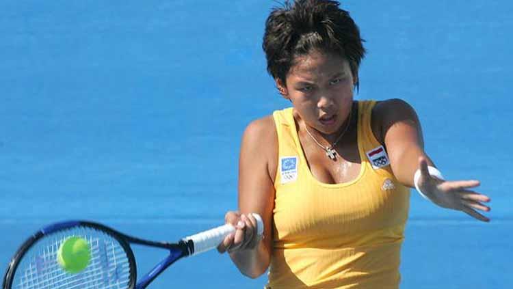 Angelique Widjaja, tiga kali tampil di nomor tunggal Australia Terbuka Copyright: AFP/Jacques Demarthon