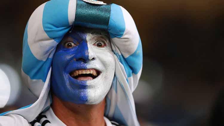 Salah satu suporter yang wajahnya berbendera Argentina pada laga semifinal Copa America di Mineirao Stadium, Rabu (03/07/19). Bruna Prado/Getty Images