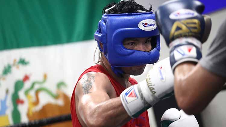 Manny Pacquiao masih akan bertinju namun untuk saat ini fokusnya adalah menangani wabah corona di Filipina.
