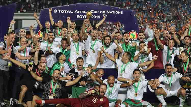 Berada di dasar klasemen dan menjadi juru kunci Grup E Piala Afrika 2021, Aljazair bikin AC Milan ketiban durian runtuh. - INDOSPORT