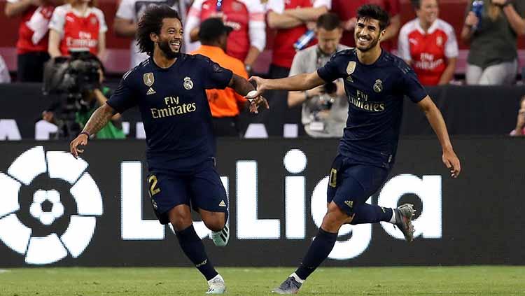 Marco Asensio dan Marcelo melakukan selebrasi usai cetak gol ke gawang Arsenal pada laga ICC 2019 di stadion FedExField (24/07/19).