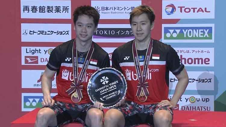 Marcus Fernaldi Gideon/Kevin Sanjaya Sukamuljo berhasil keluar sebagai juara Jepang Open 2019 usai menaklukan Mohammad Ahsan/Hendra Setiawan. Copyright: Twitter@BadmintonTalk