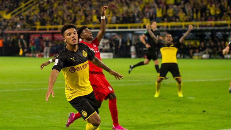 Aksi pemain Borussia Dortmund, Jadon Sancho usai cetak gol ke gawang Bayern Munchen di Piala Super Jerman, Minggu (04/08/19) Copyright: twitter.com/BVB