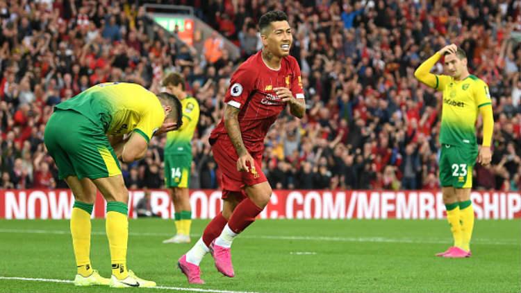 Roberto Firmino saat melakukan selebrasi di laga melawan Norwich City, Sabtu (10/08/19) dini hari WIB. Michael Regan/Getty Images Copyright: Michael Regan/Getty Images