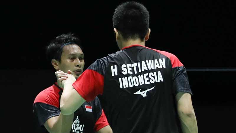 Meski memiliki persaingan hebat, Mohammad Ahsan/Hendra Setiawan tetap memberikan dukungan untuk ganda putra Malaysia. - INDOSPORT