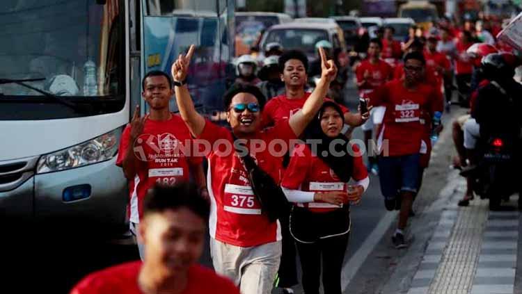 Ratusan pelari dari mengikuti lomba bertajuk De Tjolomadoe Run 7.4K, Sabtu (24/08/19). - INDOSPORT