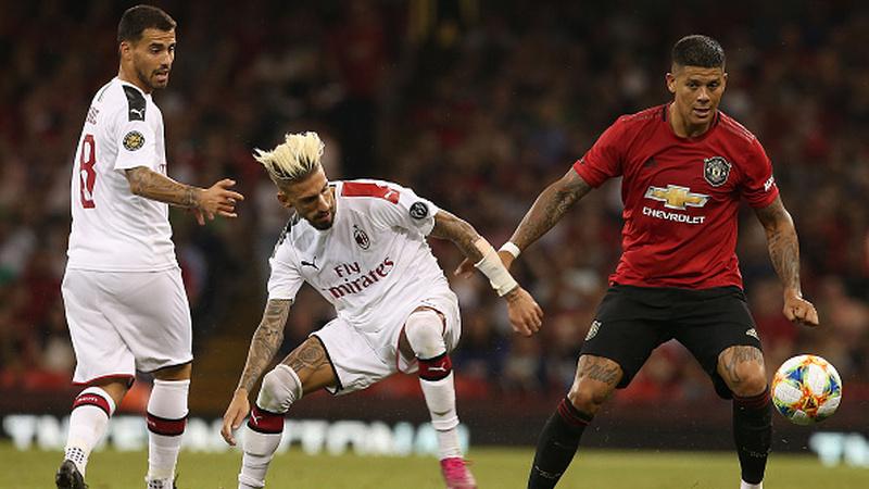 Marcos Rojo (kanan) saat bertanding melawan AC Milan Copyright: Matthew Peters/Manchester United via Getty Images