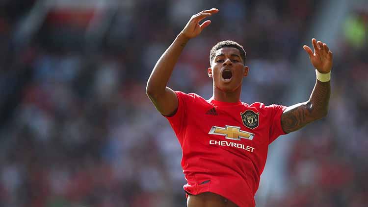 Bintang Manchester United, Marcus Rashford, menerima gelar kehormatan dari Kerajaan Inggris. Selain dia, ada 3 pesepak bola aktif yang juga memiliki gelar itu. - INDOSPORT