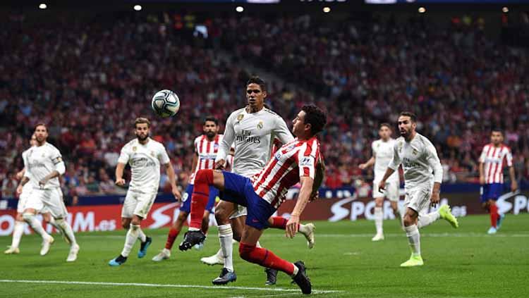 Suasana pertandingan antara Atletico Madrid vs Real Madrid - INDOSPORT