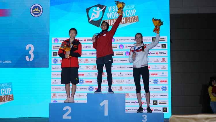 Atlet panjat tebing Indonesia, Aries Susanti Rahayu, memecahkan rekor dunia sebagai wanita pertama yang mencatatkan waktu di bawah tujuh detik. - INDOSPORT