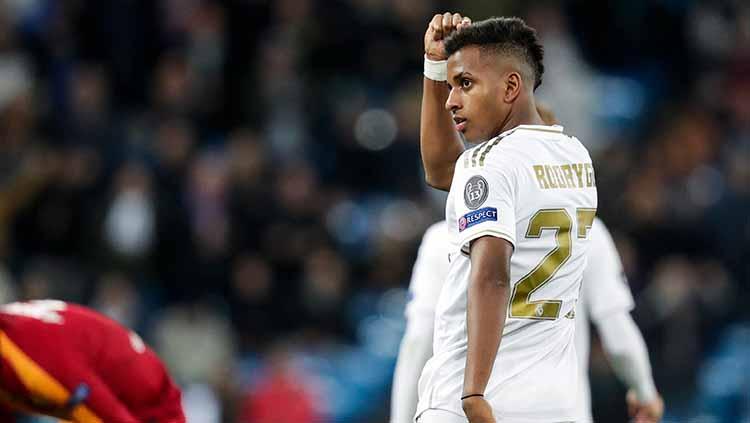 Striker Real Madrid, Rodrygo melakukan selebrasi usai cetak gol - INDOSPORT
