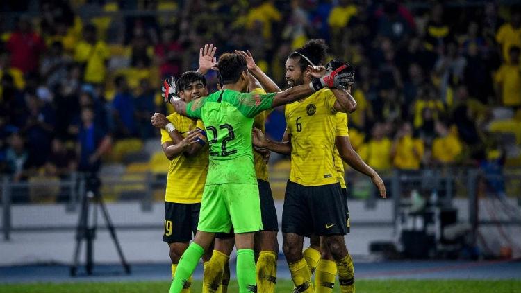 Selebrasi para pemain Timnas Malaysia usai mengalahkan Thailand di Kualfikasi Piala Dunia 2022. - INDOSPORT