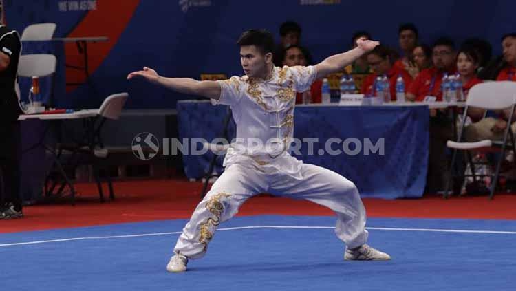 Aksi pewushu Indonesia, Edgar Xavier Marvelo di nomor changquan putra di Hall A Word Trade Center (WTC), Manila, Minggu (01/12/19). Sayang Edgar gagal menyumbang medali meski awalnya ditarget emas.