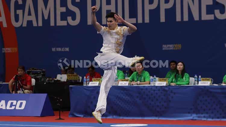 Aksi pewushu Indonesia, Edgar Xavier Marvelo di nomor changquan putra di Hall A Word Trade Center (WTC), Manila, Minggu (01/12/19). Sayang Edgar gagal menyumbang medali meski awalnya ditarget emas.