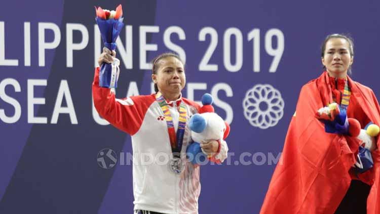 Potret kekecewaan lifter putri Indonesia, Lisa Setiawati usai gagal meraih emas di nomor 45 kg SEA Games 2019 di Nino Aquino Stadium, Minggu (01/12/19). Foto: Ronald Seger Prabowo