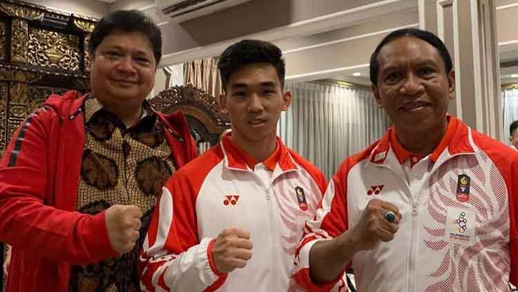 Atlet wushu Indonesia, Harris Horatius (tengah) berhasil menorehkan prestasi gemilang pada SEA Games 2019, Filipina. - INDOSPORT