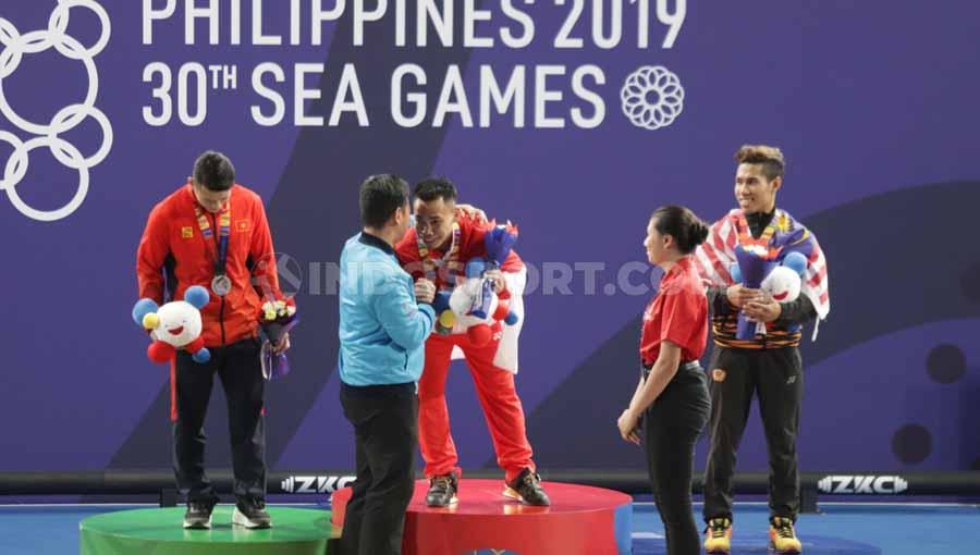 Indonesia sukses merebut 4 medali emas, 1 perak, dan 5 perunggu dari cabor angkat besi dalam perhelatan SEA Games 2019 di Filipina. - INDOSPORT