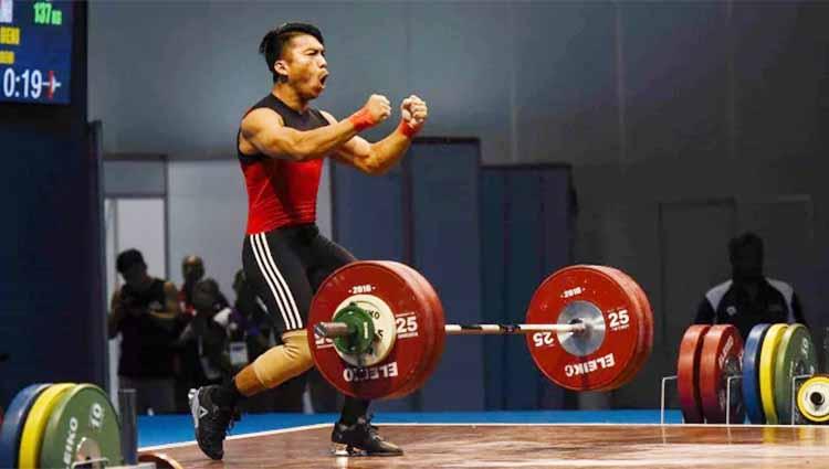 Lifter Deni mendapat tindakan tegas dari Pengurus Besar Persatuan Angkat Besi Indonesia (PB PABSI) setelah kerap melakukan tindakan indisipliner. - INDOSPORT