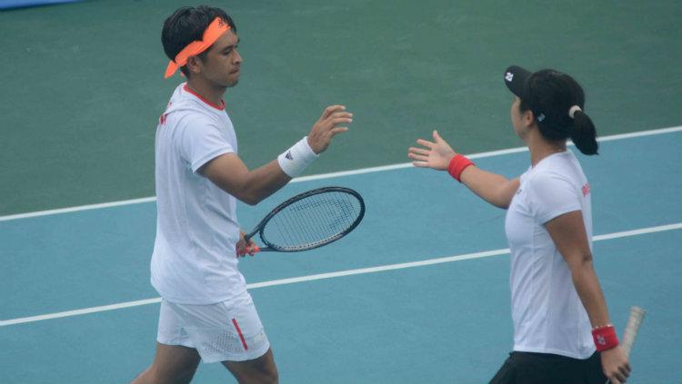 Christopher Rungkat/Aldila Sutjiadi meraih emas SEA Games 2019 usai mengalahkan pasangan Thailand, Sanchai Ratiwatana/Tamarine Tanasugarn, Sabtu (7/12/19).