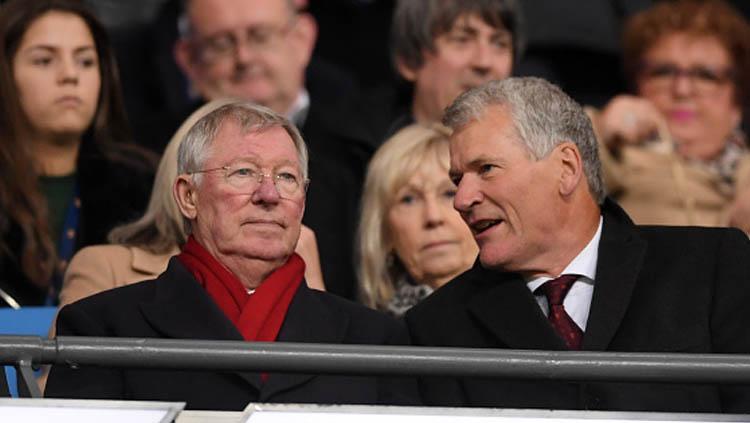 Mantan pelatih legendaris  Manchester United, Sir Alex Ferguson, takkan lagi bisa menonton langsung mantan timnya dari stadion akibat aturan baru Liga Inggris - INDOSPORT