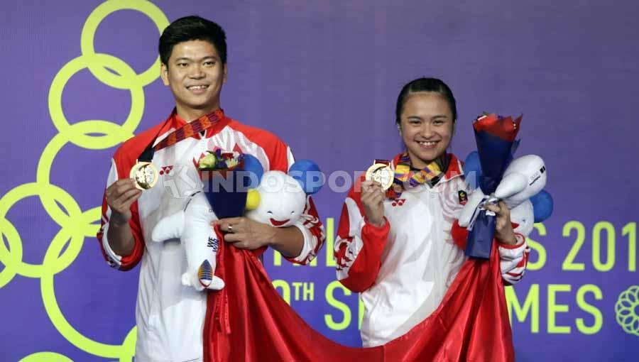 Praveen Jordan/Melati Daeva sukses meraih emas ganda campuran SEA Games 2019 bagi Indonesia dari cabang olahraga bulutangkis. - INDOSPORT