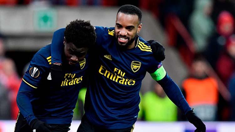 Bukayo Saka dan Alexandre Lacazette, dua sosok penting yang bawa Arsenal terhindar dari kekalahan saat melawan Standard Liege di Liga Europa 2019-2020 Copyright: John Thys/GettyImages