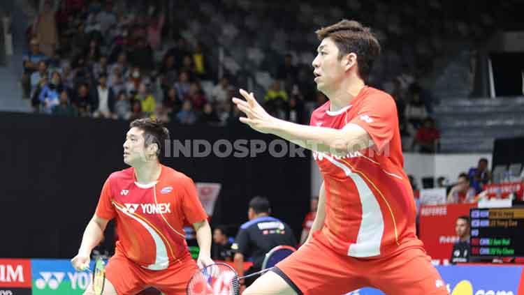 Ganda putra Korea Selatan, Kim Gi-jung/Lee Yong-dae, saat bertanding badminton - INDOSPORT