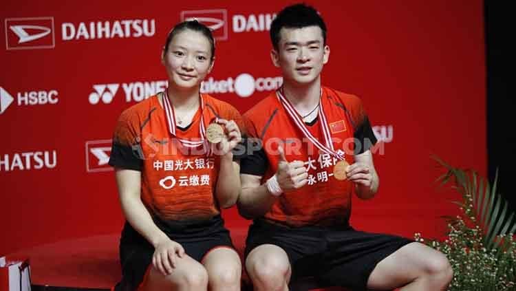 Ganda campuran China, Zheng Siwei/Huang Yaqiong mencatat rapor ajaib usai memenangkan gelar juara turnamen bulutangkis Kumamoto Masters 2023. - INDOSPORT