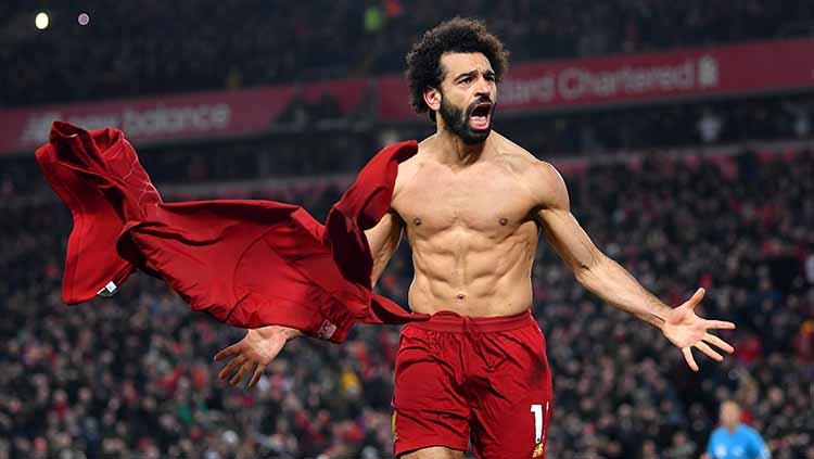 Mohamed Salah berselebrasi usai mencetak gol ke gawang Man Untied, Minggu (19/01/20). Copyright: Michael Regan/Getty Images