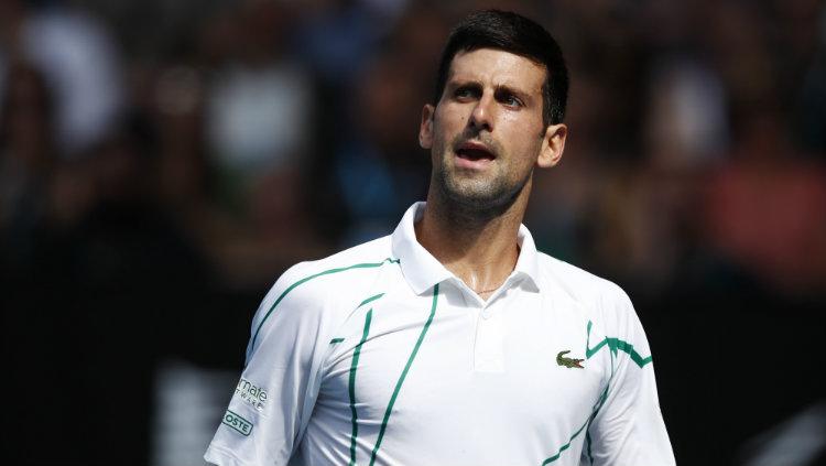 Novak Djokovic melaju ke perempatfinal Australia Terbuka 2020 usai menumbangkan Diego Schwartzman. - INDOSPORT
