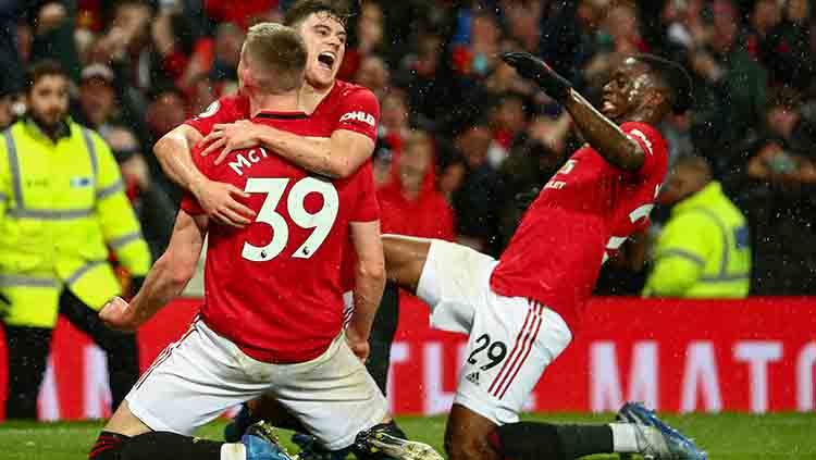 Fred dan Mason Greenwood berselebrasi merayakn gol Scott McTominay. Copyright: Robbie Jay Barratt - AMA/Getty Images