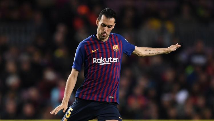 Pemain Barcelona Sergio Busquets miliki tato tulisan Arab.