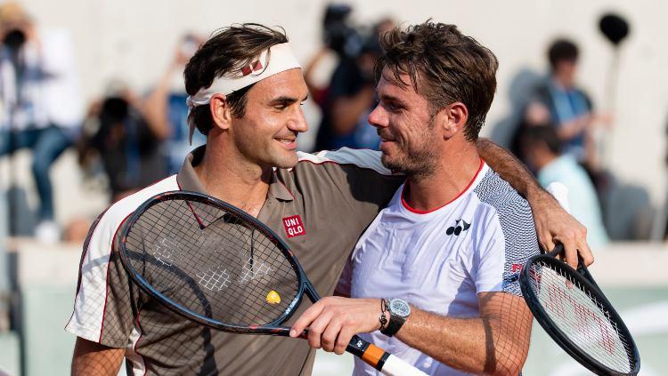 Petenis asal Swiss, Roger Federer dan Stan Wawrinka. - INDOSPORT