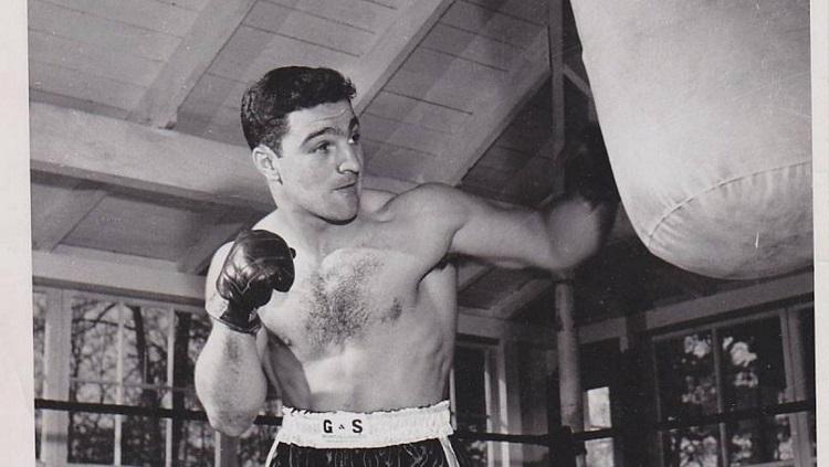 Rocky Marciano, petinju kelas berat legendaris asal Amerika Serikat.