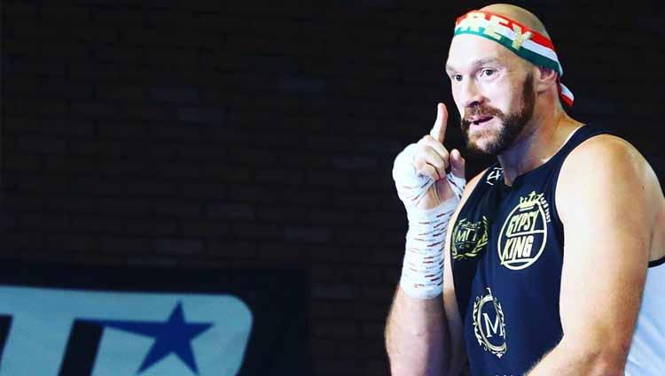Tyson Fury agaknya akan mengurungkan niatnya untuk pensiun dan saat ini sedang mengincar gelar petinju dengan bayaran terbesar sepanjang masa. - INDOSPORT