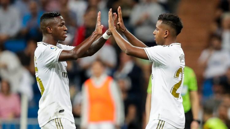 Dua bintang Real Madrid asal Brasil, Vinicius (kiri) dan Rodrgyo. Copyright: Soccrates Images/GettyImages.