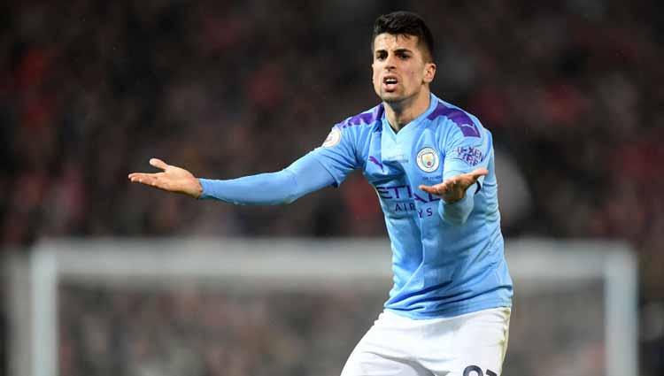 Joao Cancelo, saat masih berseragam Manchester City. - INDOSPORT
