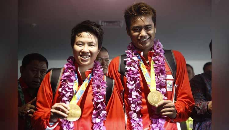 Pemain bulutangkis Indonesia Liliyana Natsir (kiri) dan Tontowi Ahmad (kanan).