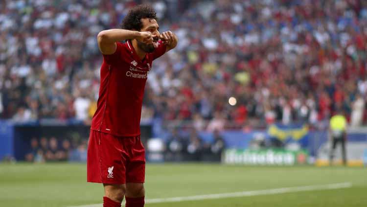 Selebrasi Mohamed Salah setelah mencetak gol pertama Liverpool melalui titik putih.