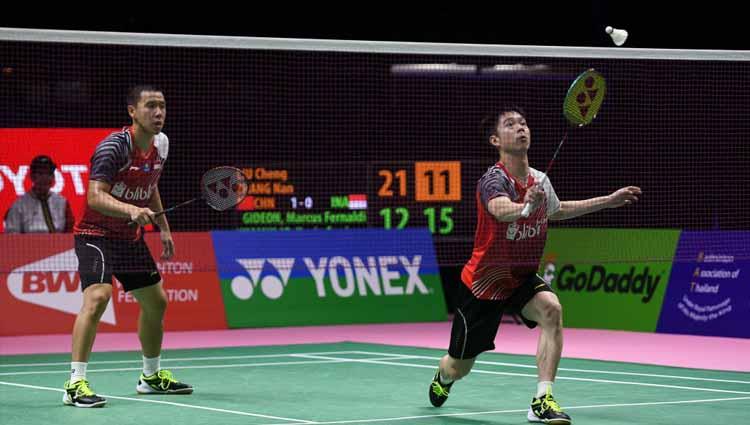 Ganda putera Indonesia, Marcus Fernaldi Gideon/Kevin Sanjaya Sukamuljo saat melawan Liu Cheng dan Zhang Nan dari China Perempat Final Thomas Cup 2018 di Bangkok, Thailand.