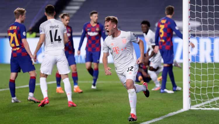 Selebrasi Joshua Kimmich usai mencetak gol ke gawang Barcelona dalam laga perempatfinal Liga Champions 2019/20.