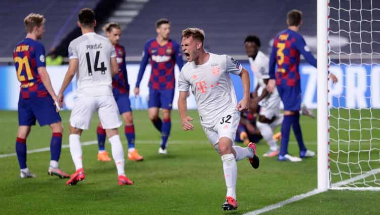 Selebrasi Joshua Kimmich usai mencetak gol ke gawang Barcelona dalam laga perempatfinal Liga Champions 2019/20. - INDOSPORT