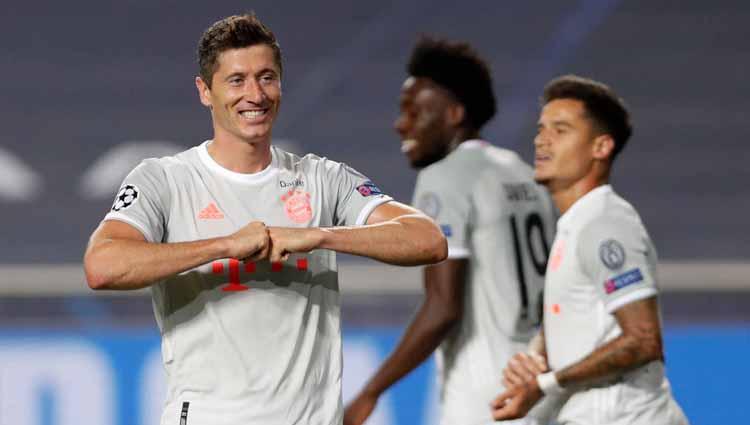 Selebrasi Robert Lewandowski usai mencetak gol ke gawang Barcelona dalam laga perempatfinal Liga Champions 2019/20.