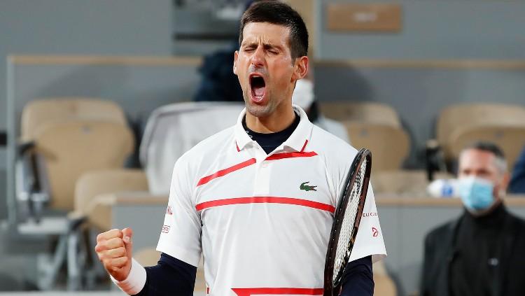 Novak Djokovic memastikan tiket semifinal Prancis Terbuka 2020. - INDOSPORT