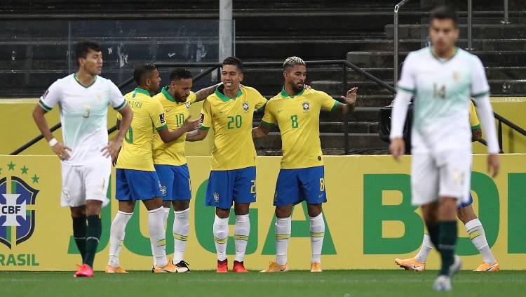 Roberto Firmino saat bermain untuk Timnas Brasil. Foto: Buda Mendes/Getty Images.