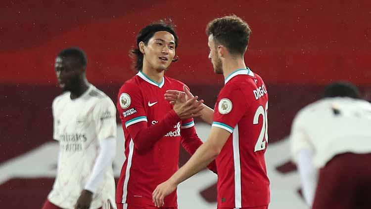 Takumi Minamino kabarnya bakal dilepas Liverpool ke AS Monaco. - INDOSPORT