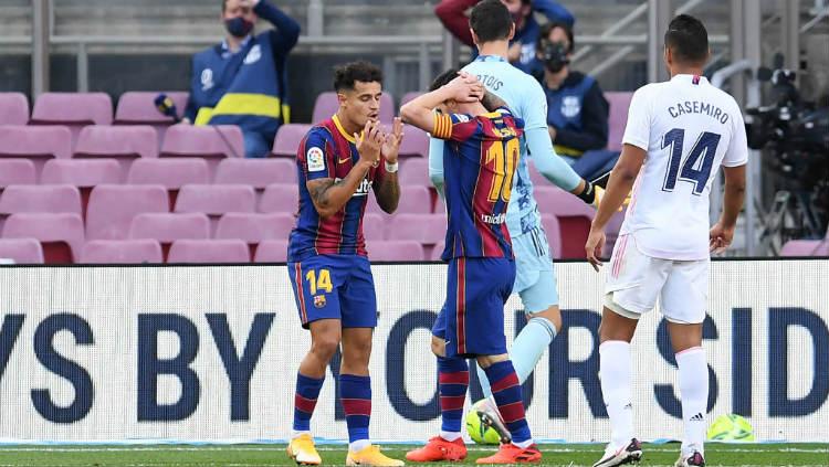 Ekspresi kekecewaan Philippe Coutinho dan Lionel Messi di laga Barcelona vs Real Madrid. - INDOSPORT